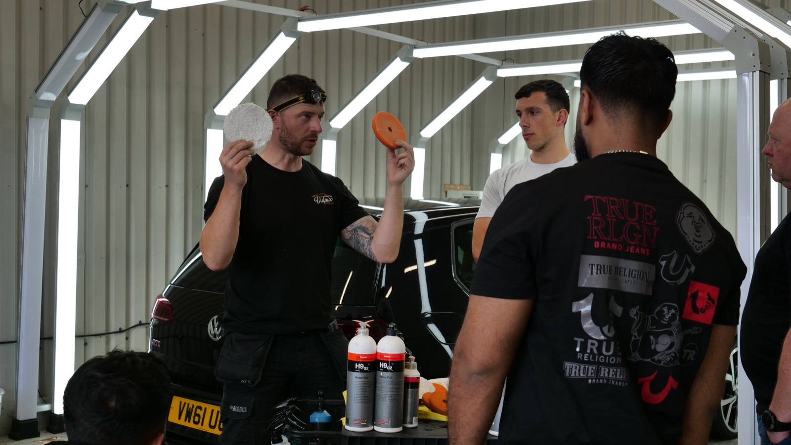 James working through a car with the group