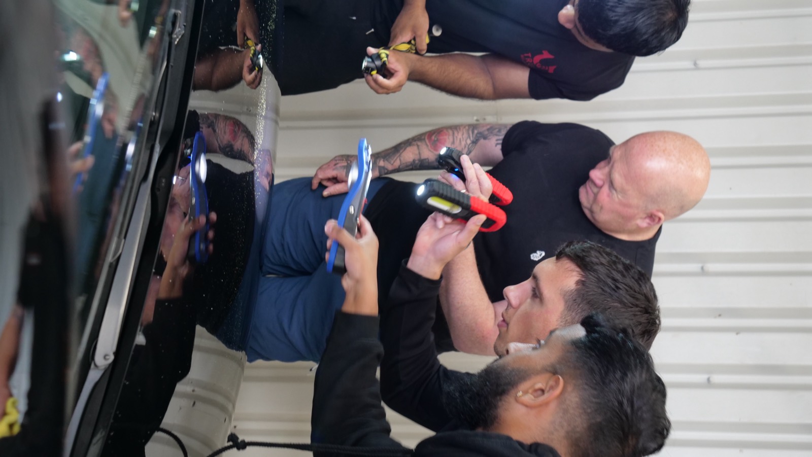 Students inspecting paintwork defects