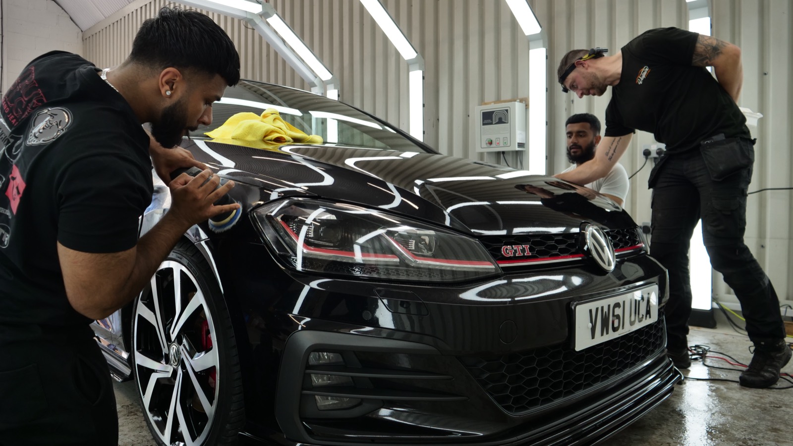 Students machine polishing cars